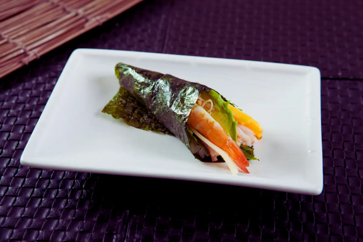 "Delicious shrimp hand roll with fresh ingredients and vibrant colors."