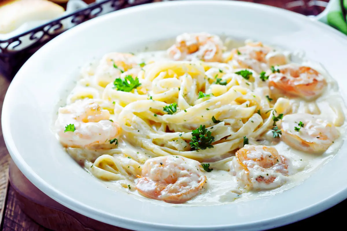 Cajun Shrimp Alfredo Pasta with fresh parsley and Parmesan.